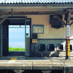 an empty train station next to the ocean