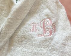 * Embroidered Cotton Robe, Long Length Cotton Bathrobe Customized * Hands down the best Stay at home Gift. A Hooded plush Robe is a Necessary Gift. They've worked so hard and when its time to unwind and relax, they can be cozy and stylish. * This Extra Soft Turkish Terry Cotton Bathrobe is warmth and comfort and also highly absorbent. * Something they can unwind and relax in, take to the beach, the pool, the spa and to the shower.  * Experience a true Luxury Retreat  style robe, a plush soft Terry robe whose quality stands out. * Personalized in their favorite color with a name, initial/s or Monogram. ( picture shows a pink Wrexam Script Name on a white) * To have a heart or crown embroidered at the back of the robe, choose front and back Embroidery and specify your color in notes to selle Personalized Bathrobe, Dorm Room Gifts, Embroidered Robe, Monogram Robes, Cotton Bathrobe, Plush Robe, Terry Robe, Initial S, Embroidered Robes