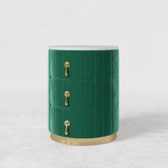 a green cabinet with gold handles and knobs on the doors is shown in front of a white background