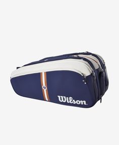 the wilson tennis racket bag is blue with white and orange trims on it