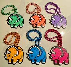 six different colored beads are arranged in the shape of pac - man and an elephant