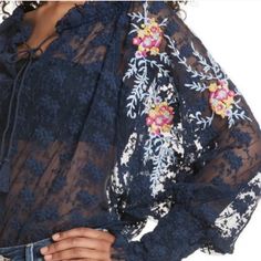 Brand New With Tags Free People Floral Lace Peasant Navy Top With Multi Colored Embroidery Throughout. Features Long Sleeves Adorned With Floral Embroidery, Elasticized Gathered Wrist, Spli V-Neck With Tie Closure, And Elasticized Waistband. Can Be Worn Off Or On The Shoulders With Adjustment Of The Tie. 100% Nylon Blue Lace Tops For Spring, Blue Bohemian Lace Top, Blue Lace Blouse For Spring, Embroidered Top, Navy Tops, Floral Embroidery, Free People Tops, Floral Lace, Multi Colored