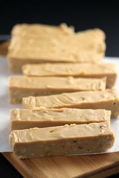 several pieces of peanut butter sitting on top of a cutting board