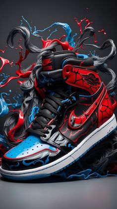 a pair of shoes with red, blue and black paint splattered on them