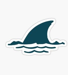 a shark fin in the ocean sticker on a white background with blue water and waves