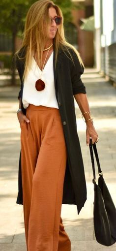 Palazzo Pants Casual Outfit, Palazzo Pants Outfit Over 50, High Waisted Flowy Pants Outfit, Rust Palazzo Pants Outfit, Rust Pants Outfit Summer, Palazzo Work Outfit, Wide Leg Pants And Kimono Outfit, Black Slouchy Pants Outfit, Black Pants Black Cardigan Outfit