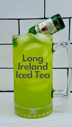 a green drink in a mug with the words long ireland iced tea on it