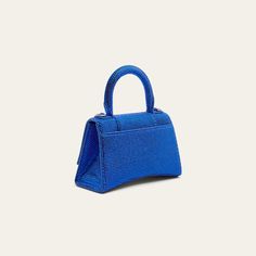 Balenciaga "Hourglass" top-handle bag in allover strass suede and calf leather Rolled top handle Removable, adjustable shoulder strap Can be worn as a top handle or shoulder bag  Flap top with hanging "B" hardware; snap closure Approx. 7.5"H x 5.1"W x 3.1"D Made in Italy Blue Evening Bag With Adjustable Handle, Top Handle Shoulder Bag With Rhinestones For Everyday, Evening Satchel With Double Handle, Evening Satchel With Adjustable Top Handle, Luxury Party Satchel With Top Handle, Evening Handheld Satchel With Adjustable Handle, Party Satchel With Double Handles, Luxury Party Satchel With Top Carry Handle, Top Handle Shoulder Bag With Dust Bag For Events