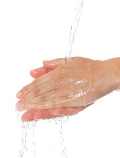 a person's hand holding water from a faucet royalty images and clippings