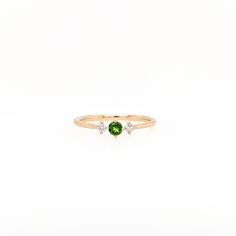 This beautiful ring features a 0.12 carat round Tsavorite gemstone with natural earth mined diamonds set in solid 14k gold. This ring makes a lovely January birthstone gift for your loved ones! This ring is made with solid 14K Gold and natural Earth mined SI / G-H diamonds. If you're interested in purchasing this setting with a different center stone please message us! Green Wedding Ring With Single Diamond, Green Ring With Single Diamond In Fine Jewelry Style, 14k Gold Green Diamond Ring With Round Band, Green Diamond Ring In Fine Jewelry Style, Green 14k Gold Diamond Ring With Round Band, Green Diamond Ring With 14k Gold Round Band, Green Single Diamond Promise Ring, Green Promise Ring With Single Diamond, Green Round Cut Birthstone Ring In 14k Gold