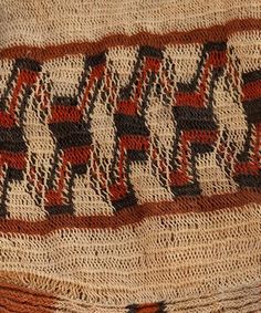 a close up of a knitted blanket with the word love written in large letters