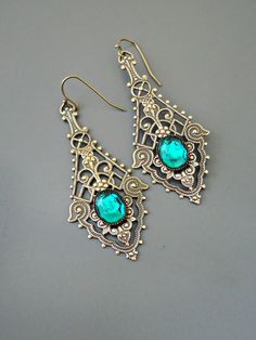 "Vintage Jewelry - Vintage Earrings - Art Nouveau Earrings - Emerald Green Earrings - Filigree Earrings - Brass Earrings - handmade jewelry These are such exquisite earrings! Gorgeous long vintage brass intricate lacy earrings embellished with an emerald green glass stone. If you would like these for your bridesmaids just let me know. Chloe says, \"Wear them and feel fabulous!\" They measure a stunning 2 1/2\" long\" from the top of the ear wire. Thanks for visiting Chloe's" Party Brass Filigree Earrings, Handmade Vintage Metal Crystal Earrings, Ornate Brass Earrings For Party, Ornate Brass Party Earrings, Artistic Jewelry With Intricate Design For Gift, Vintage Filigree Chandelier Earrings For Gift, Vintage Filigree Chandelier Earrings As Gift, Victorian Earrings For Pierced Ears For Party, Vintage Chandelier Earrings As Gift