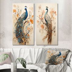 two paintings of peacocks on a wall in a living room