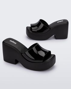 Embrace the revival of femininity in the fashion world with the Melissa Posh – the platform mule that's an essential addition to your collection! Inspired by the 90s and 2000s, it exudes a timeless nostalgic vibe. Despite the medium-height, robust heel, the shoe remains surprisingly lightweight, thanks to its advanced EVA technology. The single wide strap gives the style a minimalistic but mighty feel that will be sure to make your wardrobe even more extraordinary! 100% EVA  Despite the medium-height, robust heel, the shoe remains surprisingly lightweight, thanks to its advanced EVA technology. The single wide strap gives the style a minimalistic but mighty feel that will be sure to make your wardrobe even more extraordinary!  Wipe Clean Shoes 2000s, Single Wide, Platform Mules, Pretty Fashion, June Birthstone Jewelry, Cuff Watch, Gifts For New Mums, Pearl Jewellery Earrings, Fashion World