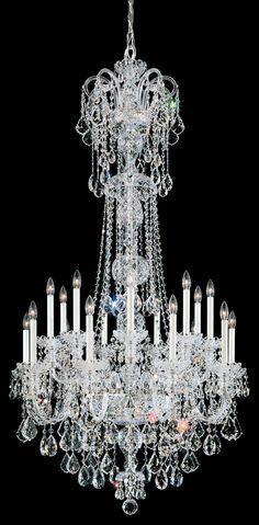 a large chandelier with many candles hanging from it