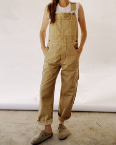 Our Unisex fit in a 100% Cotton Herringbone Twill, enzyme rinsed for a really nice feel. These are a looser and roomier fit which are based off of our favorite vintage pair of overalls! These include lots of little details including green accent stitching, a carpenter loop + pocket, and triple needle stitch seams. They are designed to fit oversized. You can size down for a more fitted look if preferred. 00 / XXS (jean size 24-25) | 0 / XS (jean size 26-27) | 1 / S (Jean size 28-29) | 2 / M (jean Carhartt Overalls Women Outfit, Tan Overalls Outfit, Mission Trip Outfits, High Waisted Overalls, Nye 2024, Overalls Outfits, Oversize Outfit, Carhartt Overalls, Farm Clothes