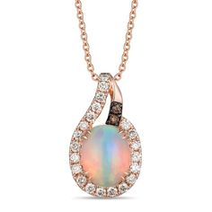 This lovely necklace from Le Vian® showcases an iridescent oval-cut Neopolitan Opal™ at the center, framed by sparkling round-cut Nude Diamonds™. Hints of rich Chocolate Diamonds® finish the look for a total diamond weight of 1/4 carat. The 14K Strawberry Gold® pendant hangs from an 18-inch cable chain and secures with a lobster clasp. Le Vian®. Discover the Legend. Starry Wedding, Chocolate Diamonds, Le Vian, Lovely Necklace, Accessories Jewelry Necklace, Opal Necklace, Luxury Women, Cable Chain, Oval Cut