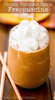 pumpkin spice frappuccino in a glass with whipped cream on top