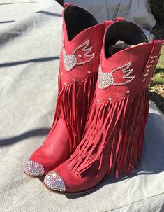 Ok, friends! Here we go1,000% authentic, genuine SWAROVSKI crystal rhinestone cowboy boots. These are not knock off stones, these are THE REAL DEAL! They are made with only the strongest adhesives and stones ranging in sizes from 3-6 mm for the brightest sparkle Soooooo fun! These boots are a gorgeous shade of deep crimson red, and are encrusted throughout with clear stones. These are man made material boots, yet still very nice quality. They have a really neat fringe flow curtain as well....I l Western Rhinestone Fringe Boots For Fall, Western Boots With Rhinestone Fringe For Fall, Western Snip Toe Boots With Rhinestones, Western Boots With Rhinestones And Snip Toe, Western Style Snip Toe Boots With Rhinestones, Western Rhinestone Boots With Round Toe, Rhinestone Boots With Round Toe For Rodeo, Western Boots With Bling And Round Toe, Western Boots With Rhinestones And Round Toe