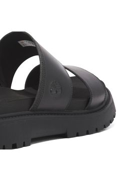 Crafted with responsibly sourced leather, this two-strap slide sandal offers walkable comfort with OrthoLite® cushioning, a faux-suede lining and a lug sole. 1 1/2" heel OrthoLite footbed Leather upper/textile lining/rubber sole Imported Timberland Leather Sandals With Cushioned Footbed, Timberland Leather Sandals With Removable Insole, Casual Leather Timberland Sandals, Timberland Synthetic Sandals With Removable Insole, Lug Sole, Sandal Women, Strap Sandals, Slide Sandals, Black Sandals