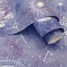 a purple and white wallpaper with stars, circles and arrows on the ground next to a ruler