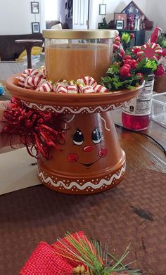 two tiered trays filled with candy canes on top of a wooden table