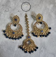 We are thrilled to introduce our exquisite collection of Indian earrings in Navy Blue. These stunning earrings are crafted to enhance your style, whether you're attending a party or a wedding ceremony. They are guaranteed to make you stand out in the crowd.Elevate your style with these stunning Earrings. Make a bold fashion statement and turn heads wherever you go. Shop our stunning collection today!We have a wide range of colors available, so be sure to check our other listings to find the perfect match for your style. In addition to this earring, we have a wide variety of Indian Pakistani jewelry. Explore our shop to discover the perfect piece for your collection. If you're having trouble viewing our photos, try increasing your screen brightness for a clearer image.We aim to dispatch you Blue Latkan Danglers For Wedding, Blue Latkans Danglers For Wedding, Blue Festive Jhumkas Drop Earrings, Blue Jhumkas Drop Earrings For Festive Occasions, Blue Kundan Chandbalis For Celebration, Blue Bollywood Jewelry Sets For Gift, Blue Bollywood Style Jewelry Sets For Gift, Blue Drop Danglers For Festive Occasions, Festive Blue Danglers For Gift