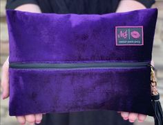 The Purple Rain bag is a velvet exterior with a onyx wipeable interior. Our designers ensure that each handcrafted Purple Rain bag comes with a onyx Zipper and coordinating tassel. *Each Makeup Junkie Bag comes with designer, moisture resistant, interior liner* Bag Dimensions: Mini 4 x 7 inches Small 7 x 9 inches Medium 8 x 11.5 inches Large 9.5 x 13 inches *Please note that bag sizes can vary up to 3/4" in size due to fabric density. Care Instructions: Glitter bags are spot treatment only, Do n Fanny Pack Purse, Glitter Bag, Mobile Boutique, Small Makeup Bag, Fall Over, Mini Makeup, Travel Purse, Suede Tassel, Wet Bag