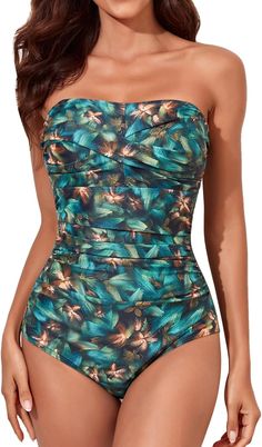 This one piece swimsuit combines fashion and function. The strapless design allows for ease and comfort while the ruched design provides a flattering fit. Padded cups offer support and enhance the natural shape. Perfect for a day at the beach or lounging by the pool. 82% Nylon, 18% Spandex The swimsuit includes double shoulder straps which help you to adjust your swimsuit, and it can also be removed. With the help of 2 different style options, you can make it either double shoulder strap swimwea Strapless Ruched Swimwear For Sunbathing, Green Strapless Swimwear For Beach Party, Ruched Bandeau Swimwear For Sunbathing, Bandeau Tankini For Beach Season And Pool, Bandeau Ruched Swimwear For Sunbathing, Strapless Tropical Tankini For Poolside, Green Strapless Stretch Swimwear, Summer Bandeau Tankini For Pool, Tropical Strapless Swimwear