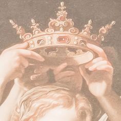 a woman holding a crown over her head