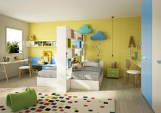 a child's bedroom with yellow walls and white furniture