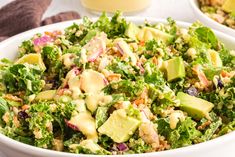 two white bowls filled with salad and dressing