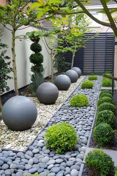 a very nice looking garden with some big balls