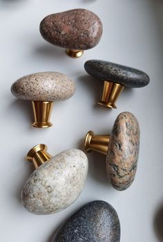 several different types of rocks and knobs on a white surface