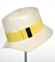 "\"Kami\" is pure elegance. The handmade hat is available in the high-quality \"parasisol\" with a lemmon yellow coloured hatband. Available in sizes 55 cm - 58 cm. Colour \"natur\" with a lemmon yellow coloured hatband and black accent Parasol hat (plaited straw) 66% cotton and 34% polyamide on the inside Ribbon of cotton and viscose Handmade Individualization options Other colours or sizes on request. All hats are handmade. For the production of a perfect hat it takes some time. All hats are r Designer Bucket Hats, Womens Straw Hats, Summer Straw Hat, Yellow Hat, Pure Elegance, Handmade Hat, Hat Band, Black Accents, Summer Hats