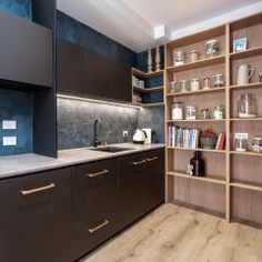 a kitchen with brown cabinets and white counter tops