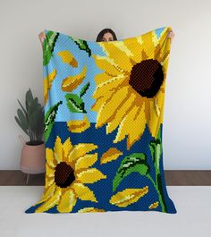 Embrace the warmth and beauty of sunflowers with our Sunny Blooms in a Field C2C Crochet Pattern. This exquisitely designed digital pattern will guide you through creating a stunning blanket that captures the vibrant colors and cheerful essence of a sunny field filled with blooming sunflowers. Perfect for adding a touch of nature-inspired charm to your home decor, crafting thoughtful gifts, or simply indulging in a delightful crochet project. Features: Dimensions: Generous size to keep you warm Crochet Sunflower Blanket, Sunny Field, Sunflower Blanket, C2c Crochet Pattern, Fields Of Flowers, Flowers Crochet, Cozy Wrap, Crochet Sunflower, C2c Crochet