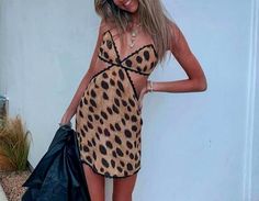 Vienna Dress Chic Leopard Print Mini Dress For Beach, Chic Leopard Print Mini Dress For Date Night, Leopard Print Mini Dress For Beach, Chic Leopard Print V-neck Mini Dress, Leopard Print Mini Beach Dress, V-neck Leopard Print Mini Dress For Day Out, Leopard Print V-neck Mini Dress For Day Out, Trendy Leopard Print Sleeveless Dress, Leopard Print Flirty Mini Dress