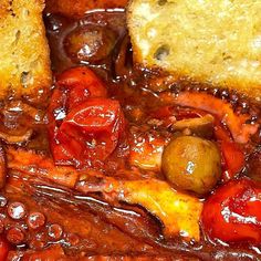 a close up view of some bread and tomatoes