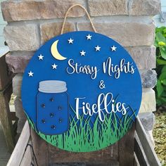 a blue sign that says, starry nights and freebies with a mason jar on it