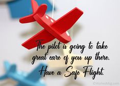 a red toy airplane hanging from a string with the words, the pilot is going to take great care of you up there have a safe flight