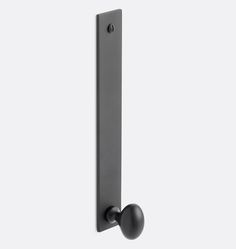 a black door handle with two balls on the front and one ball on the back