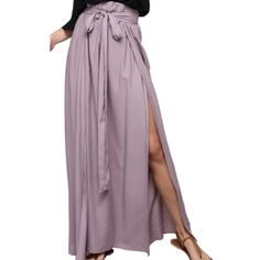 New And Unused! Make A Statement And Step Into Spring/Summer In This Gorgeous Lilac Colored Maxi Skirt! The Skirt Features Flirty Double High Slits, Elastic Waistband And Attached Waist Bow-Tie. Skirt Is Breathable And Flowy When You Walk! 100% Rayon Small Will Fit Sizes 2-4 Medium Will Fit Sizes 4-6 Flat Measurements: Small: Waist: 13.5" Medium: Waist: 14.5" Summer Maxi Length Bottoms For Brunch, Summer Maxi Bottoms For Brunch, Chic Wide Leg Summer Skirt, Summer Flowy Skirt With Tie Waist, Spring Vacation Bottoms With Split Hem, Spring Tie Waist Maxi Skirt, Relaxed High-waist Maxi Skirt For Day Out, Long Wrap Skirt Lined For Brunch, Long Lined Wrap Skirt For Brunch