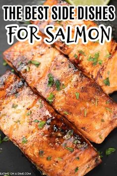 the best side dishes for salmon on a black plate with lemon wedges and cilantro