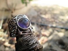 From Porans collection ----> Unique Sterling Silver Carved Band Ring with a big round Amethyst (cabochon 8mm). Dimensions: Max Width:0.7 inches Can be any size you need. available with many other stones! Please contact me with any question. our jewelry shop on Etsy: http://www.etsy.com/shop/Porans Thank you for Visiting Our shop Please visit my shop policies for additional information Bohemian Jewelry With Bezel Setting In Round Shape, Unique Amethyst Cabochon Ring, Bohemian Round Jewelry With Bezel Setting, Unique Cabochon Amethyst Ring, Bohemian Round Bezel Set Jewelry, Unique Round Cabochon Crystal Ring, Unique Cabochon Crystal Ring, Nature-inspired Round Cabochon Jewelry, Unique Amethyst Ring With Natural Stones