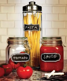 pasta and tomato sauce in glass jars with labels on them