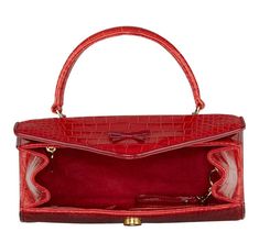 Handmade in New York, the Elene bag is crafted with lipstick red Italian crocodile embossed leather. Features cranberry patent piping, signature bow detail, gold hardware, and a magnetic snap closure. Lipstick Red, Bow Detail, Embossed Leather, Emboss, Gold Hardware, Piping, Snap Closure, Cranberry, Muse