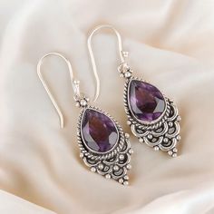 Welcome to our little shop, where you can find handmade Silver Gemstone Jewelry and more, for you and your loved ones. We do accept custom orders also, kindly message us for more. Gemstone Name:- African Amethyst Stone Shape : Pear  Stone Weight: 37.45CT Stone Size: 10x14mm Earring Length: 1.9 Inch Metal : Sterling Silver   Metal Purity : 925  Jewelry Care Tips:- ----------------------- [1] Store it properly: Store your jewelry in separate compartments or pouches to prevent scratching and tangli Bohemian Sterling Silver Gemstone Earrings, Amethyst Dangle Earrings Stamped 925, Pierced Sterling Silver Drop Crystal Earrings, Stamped 925 Dangle Earrings As Gift, Purple Dangle Jewelry Stamped 925, Sterling Silver Drop Crystal Earrings With Gemstones, Silver Gemstone Dangle Teardrop Earrings, Sterling Silver Gemstone Drop Earrings, Gemstone Dangle Earrings For Gift