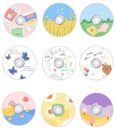 six cd's with different designs on them, all in various colors and sizes