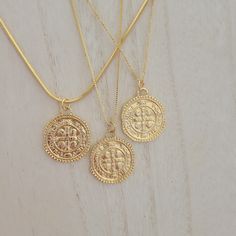 Round gold coin medallion necklace. Double sided imperfect medallion coin. Wear it on it's own or layer it. Pendant details: * Finish: non tarnish gold filled * Measurements: 1.1'H 0.75'WChain: non tarnish gold filledComes in our gift ready packaging: vegan leather pouch for safe jewelry storing and branded box Gold Medallion Locket Necklace, Gold Tarnish-resistant Medallion Coin Necklace, Gold Charm Necklaces With Coin Pendant, Gold Medallion Necklace With Tarnish Resistant Round Disc, Gold Coin Necklace Tarnish Resistant, Gold Tarnish Resistant Coin Necklace, Tarnish Resistant Gold Coin Necklace, Gold Tarnish Resistant Round Disc Coin Necklace, Gold Tarnish-resistant Round Disc Coin Necklace